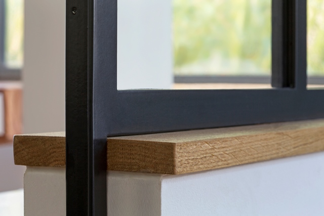 Cloison atelier d'artiste avec finition couleur thermolaquée satiné (RAL 7016 gris anthracite).